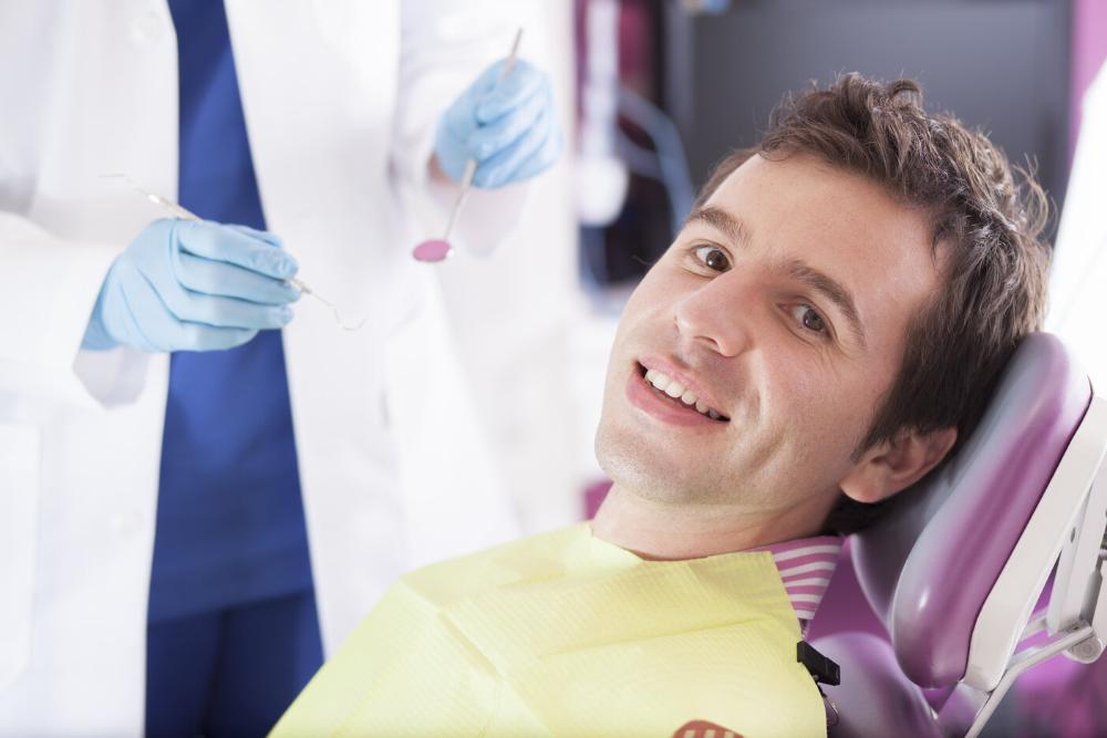 man smiling after wisdom teeth extraction