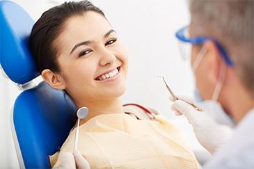 woman smiling in dental chair in blacktown