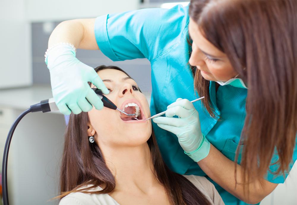 woman getting tooth extracted