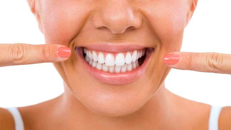 woman pointing at bright smile