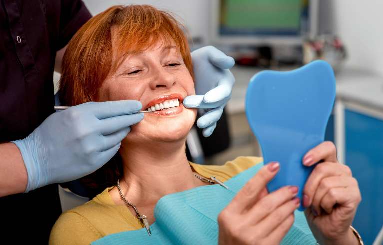 woman getting dental cleaning