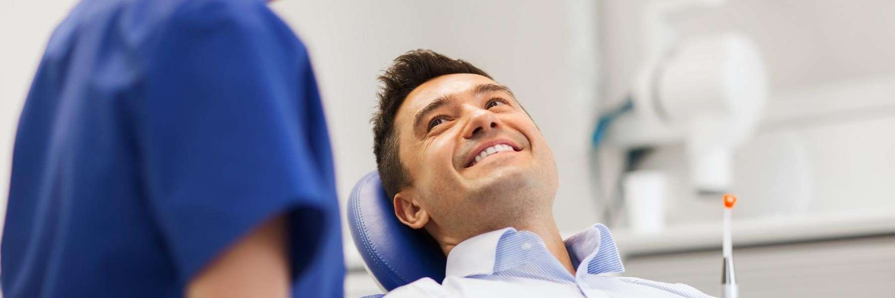 man sittingi n a dental chair